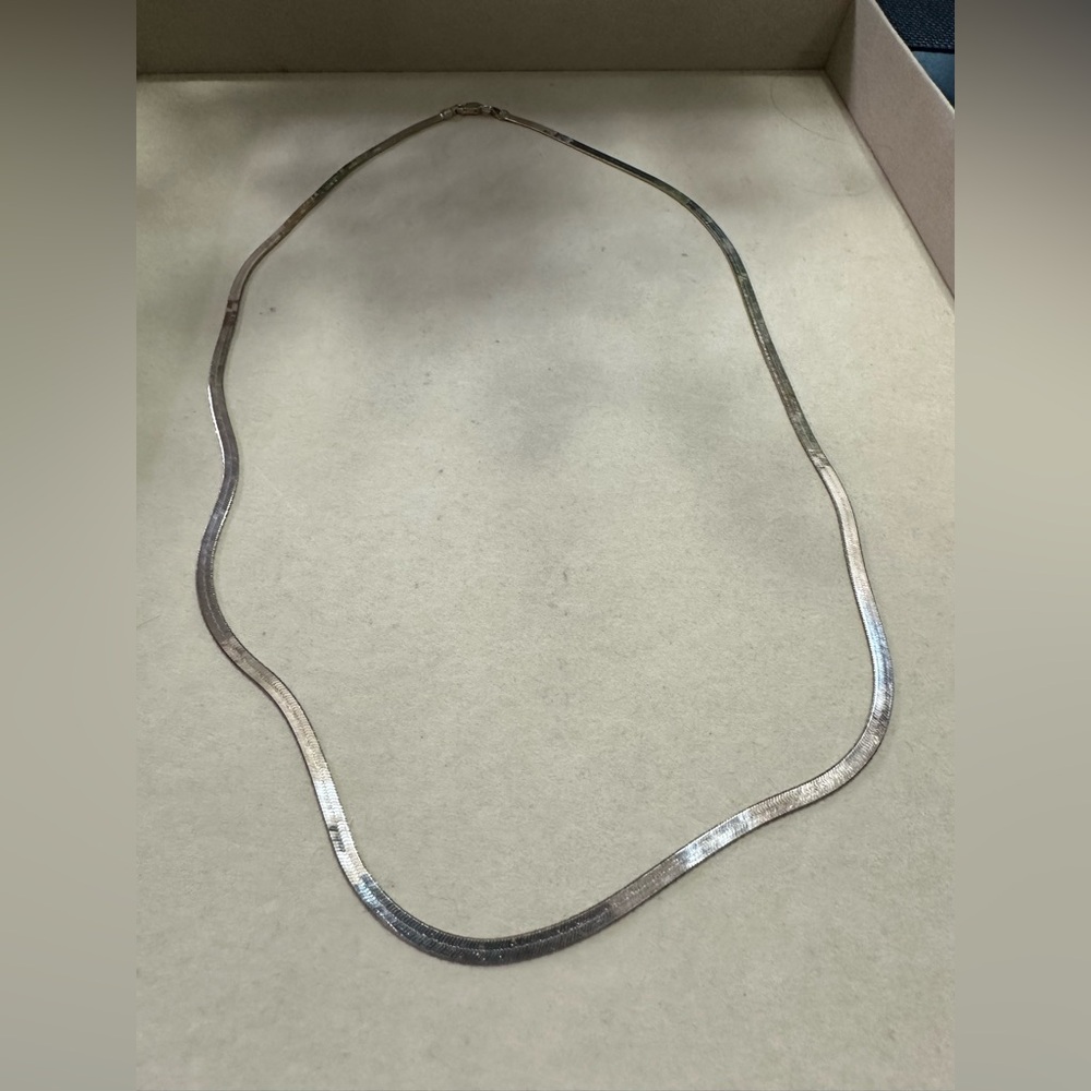 Sterling silver 24” herringbone chain.
